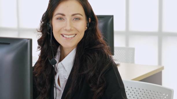 istock Business people wearing headset working in office 1259277464