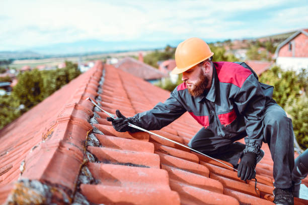 istock Worker Focused Of Measuring Roof Tile Dimensions Before Installing Solar Panel 1259296555