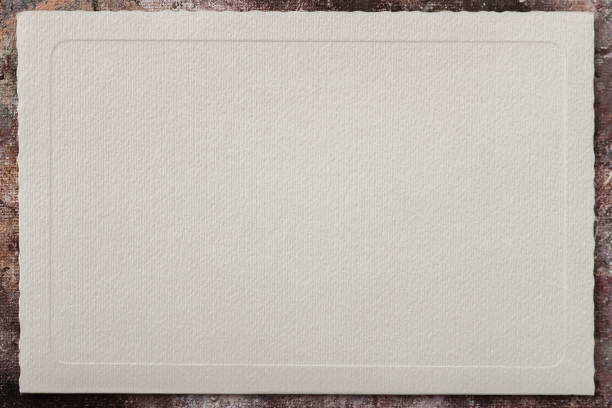 Light cream paper with an embossed patterned frame, an empty field for your design, colorful borders, backdrop. Copy space