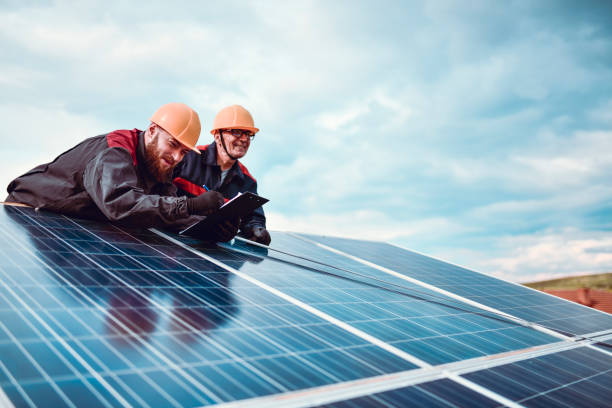 istock Workers Of Different Generations Installing And Repairing Solar Panels Together 1259301337