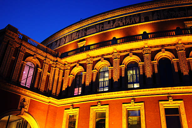 The Royal Albert Hall At night Night shot of the Royal Albert Hall, built 1867-71 to commemorate the death of Queen Victoria's beloved consort Prince Albert. It is the leading classical music venue in The UK and is the home of the Proms royal albert hall stock pictures, royalty-free photos & images