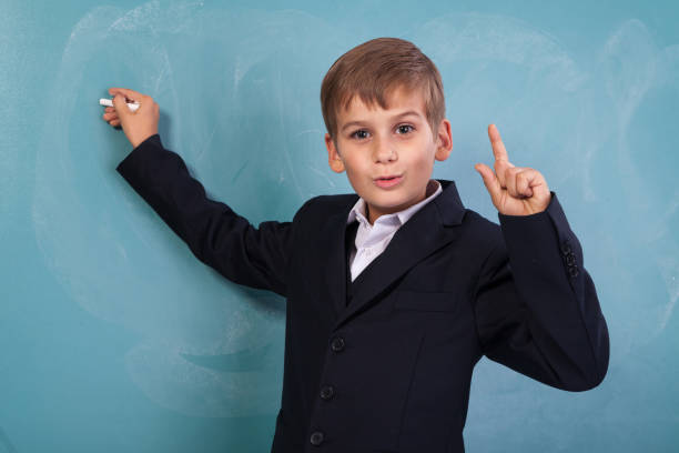 istock School student writing on blackboard at school 1259327274
