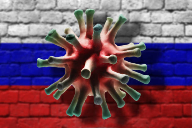 istock Coronavirus cell on the brick wall painted in russian flag colors background with shadows 1259332432