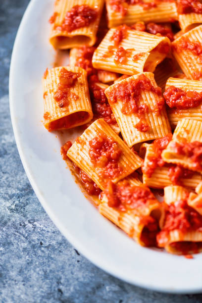 istock rustic italian paccheri pasta in tomato sauce 1259354199
