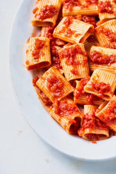 istock rustic italian paccheri pasta in tomato sauce 1259354203