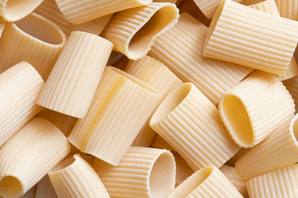 istock italian paccheri pasta raw uncooked food background 1259354214