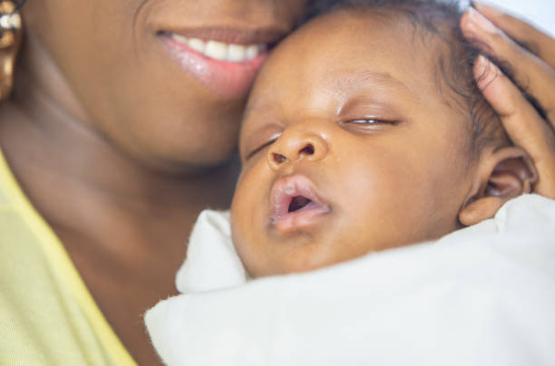 istock Mother and newborn baby 1259356292