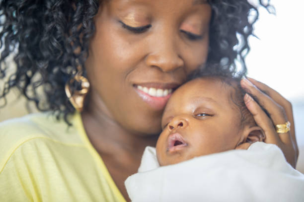 istock Mother and newborn baby 1259356800