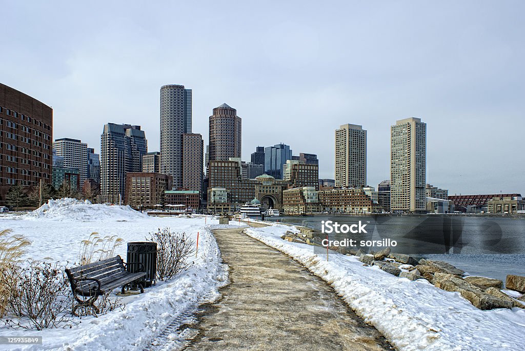 south boston in winter view of boston harbor and rowes wharf and skyscraper buildings in south boston massachusetts in winter. Boston - Massachusetts Stock Photo