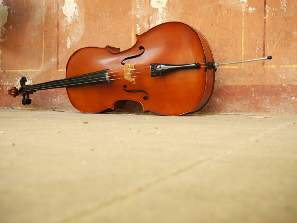 istock Cello on the white stone floor. Copy space 1259366619