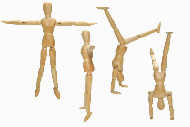 istock Wooden human figure different posting on white background 1259373782
