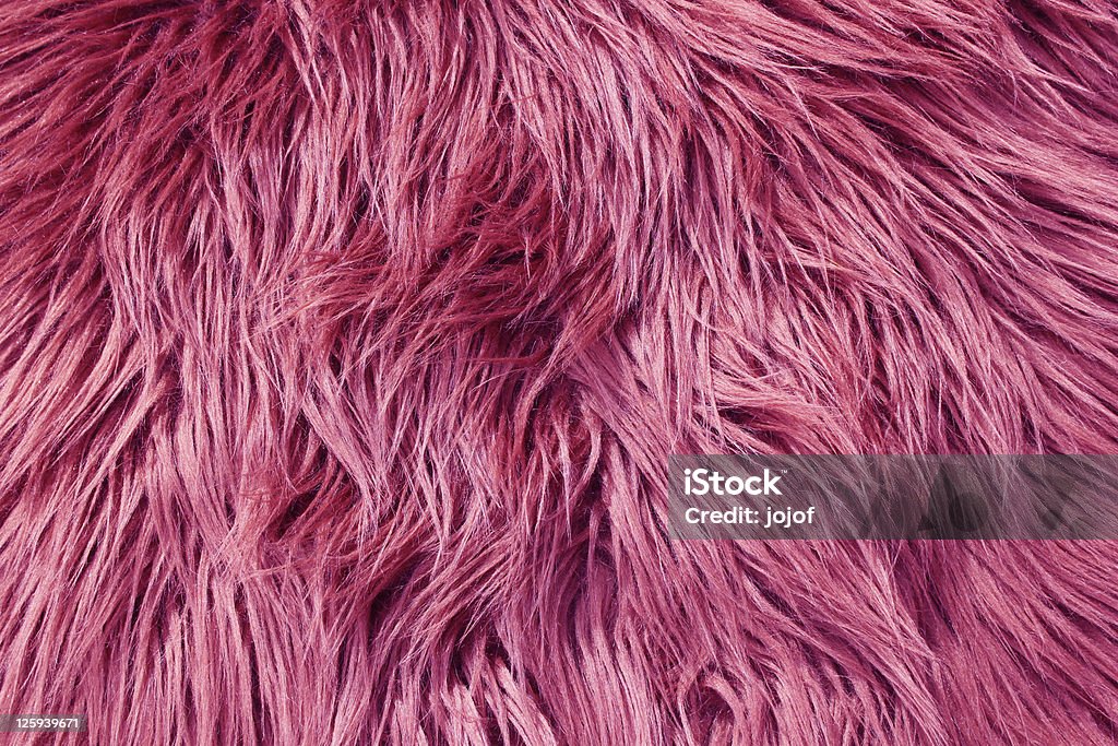 Pink fur background Close up of pink fluffy fabric Fake Fur Stock Photo