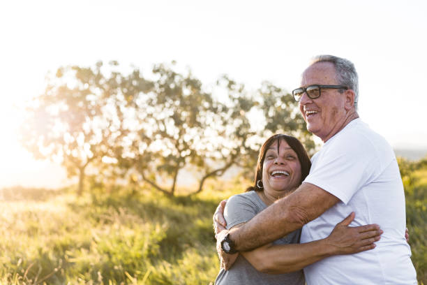 istock Embraced senior couple having fun during sunset 1259406372