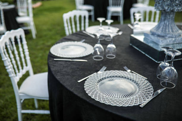 istock Wedding invitation, Organization Table Layout, Cutlery and Glass Plate On Black Background 1259416394