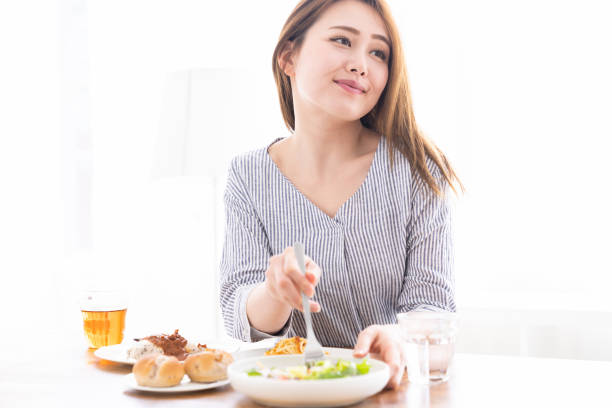 istock asian woman who eats 1259423622