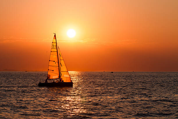 istock Sailing boats on a background of sunset 125942460