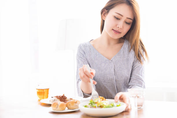 istock asian woman who eats 1259424660