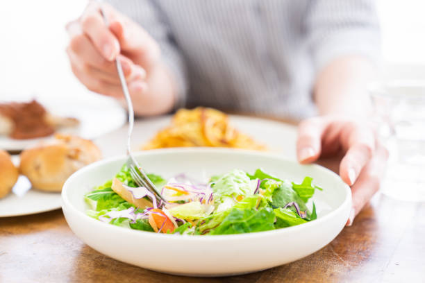istock asian woman who eats 1259425181