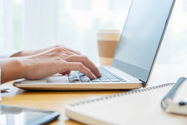 istock Close-up of a business man's hand using a laptop 1259449011