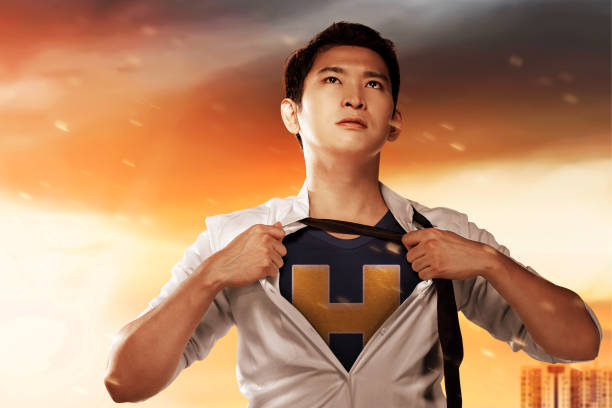 Asian businessman act like a superhero in the city