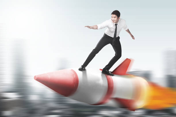 istock Asian businessman flying on a rocket 1259463511