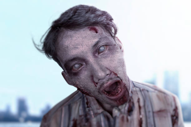 istock Scary zombie with blood and wound on his body standing 1259476567