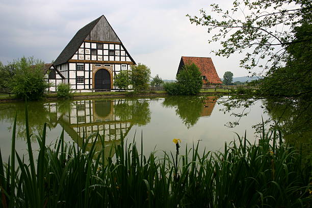 Half-timbered houses at the village pond stock photo