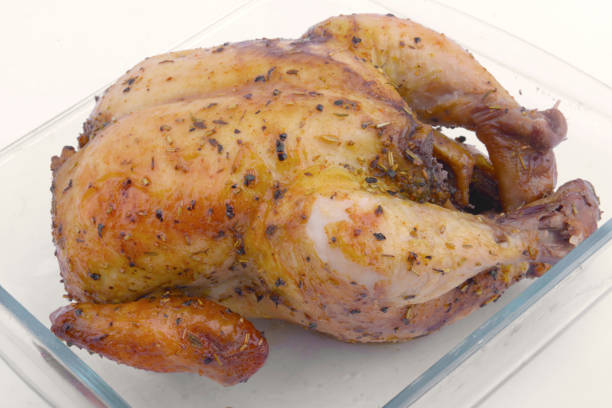istock Roast chicken in glass baking tray 1259496799