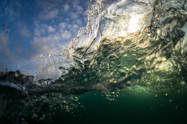 istock Splashing waves at sunrise 1259503662