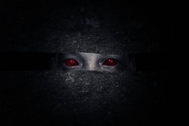 Scary zombie hiding behind the wall with dark background