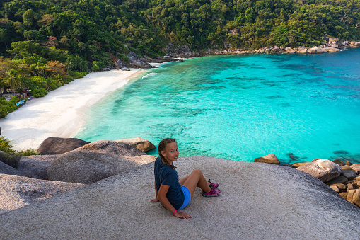 The girls stand on the point of view of the sail Rock island of Similan. Freedom traveller woman to enjoy the beautiful nature on Similac No. 8 in the national Park of Similan Islands, Phuket, Thailand. Travel concept