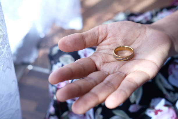 istock Woman hand with engagement ring, close up 1259536582