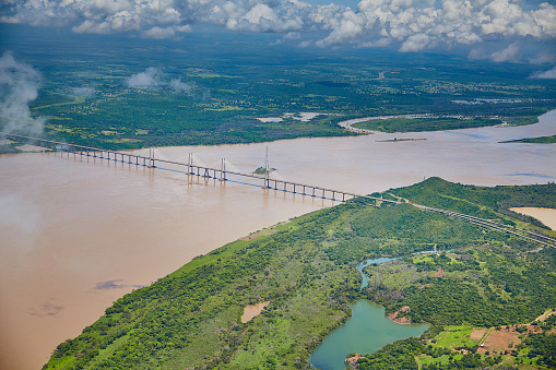 Orinoquia bridge over Orinoco river. Puerto Ordaz, Venezuela. The Orinoco is the second river in South America following the Amazon River in Brazil. It is one of the longest rivers with 2,140 km and its drainage basin covers 880,000 square kilometres. The Orinoco and all its tributaries are the main transport system for eastern and interior Venezuela and the llanos of Colombia.