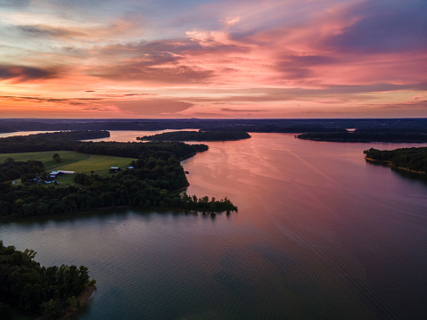 Aerial shot over the lake during dawn after rain.