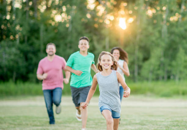 istock Family running outside together 1259615915