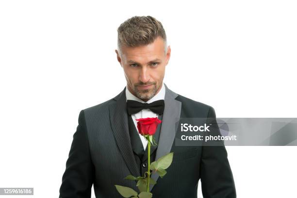 Celebrating Womens Day Handsome Man Hold Red Rose Flowers For Womens Day Bachelor In Formalwear International Womens Day March 8 Floral Gift On Womens Day Stock Photo - Download Image Now
