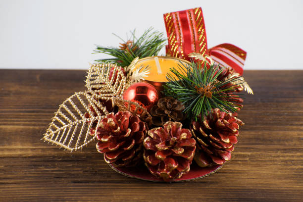 istock Orange candle with christmas decoration. 1259641231