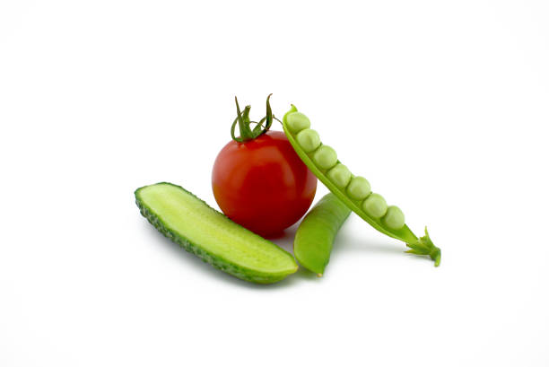 istock Red ripe tomato, peas in a pod and cucumber 1259654143