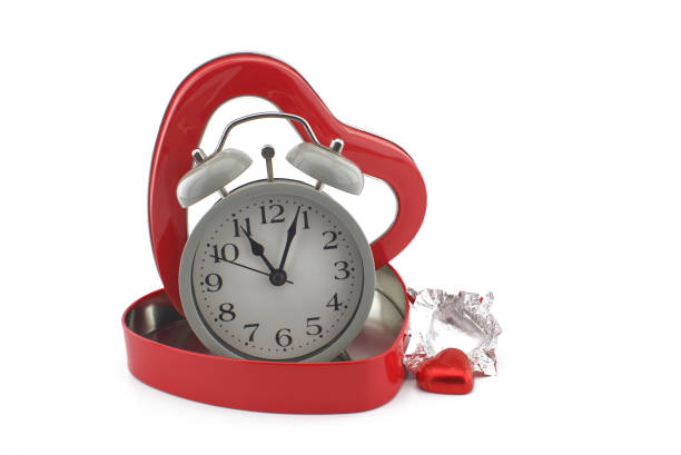 istock Retro alarm clock in a red heart shaped box 1259654649