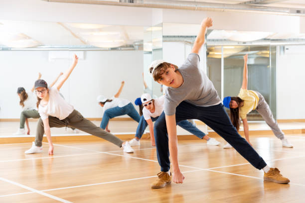 istock Teenagers training hip hop in dance studio 1259699497