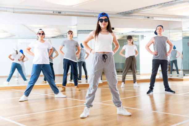 istock Teenagers training hip hop in dance studio 1259700019
