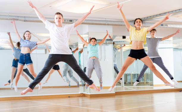 istock Group of young dancers jumping together in class 1259700061