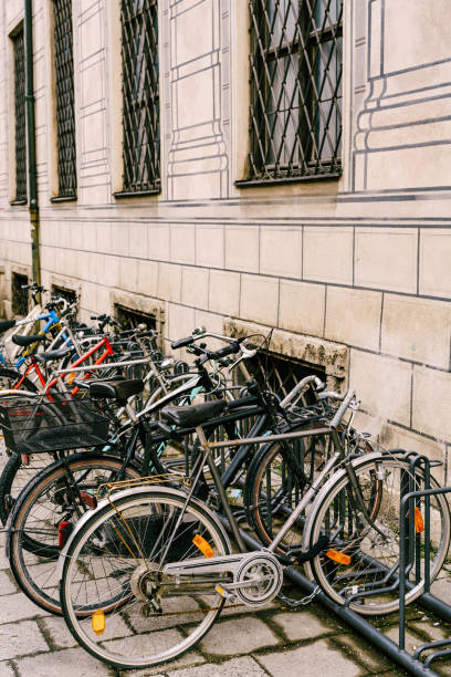 istock Bicycle parking by a beige building with barred windows 1259716800