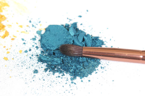 Colorful Broken Cosmetic Pigments on White Background