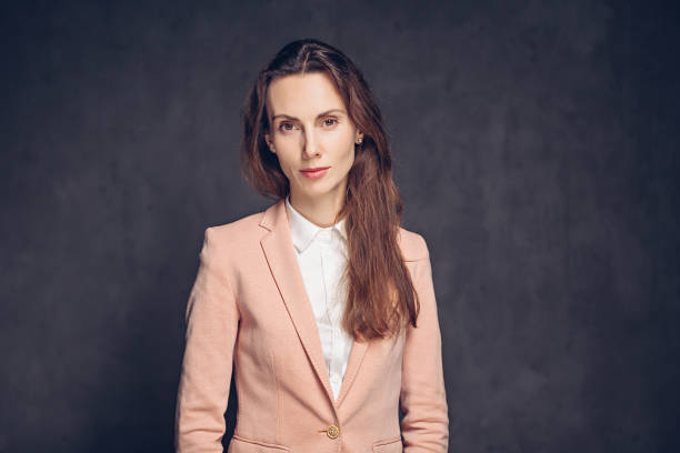 istock Concentrated caucasian woman on dark background 1259759297