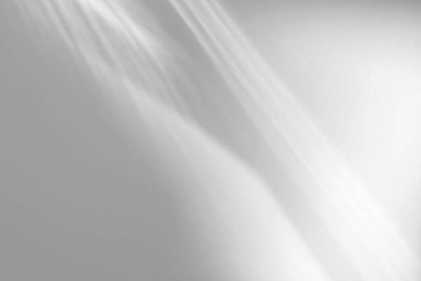 istock diagonal shadow and rays of light on a white background 1259759907