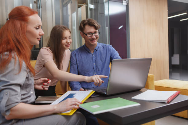 istock Business people at open space office 1259764141