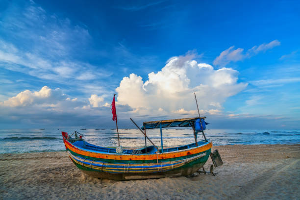 istock Fishing boat to dawn on the beautiful beach 1259778990
