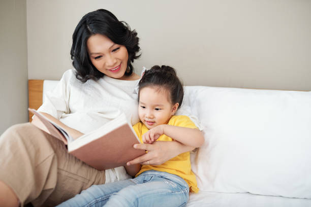 istock Reading mother and daughter 1259781684