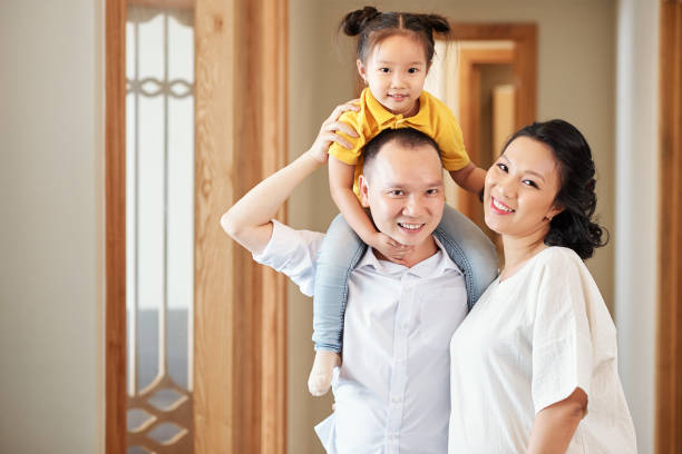 istock Smiling mother, father and little daughter 1259781727